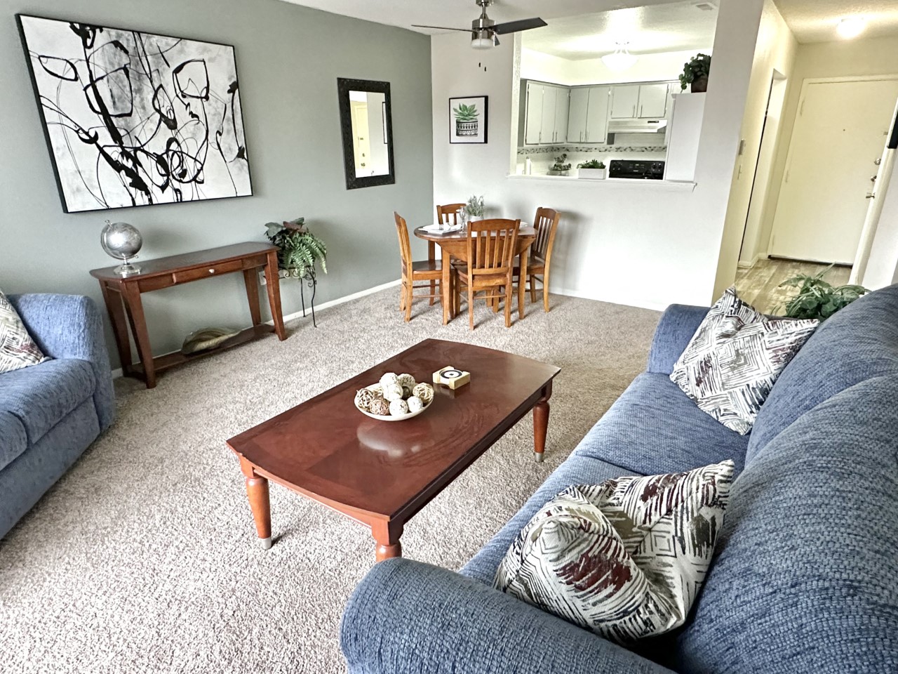 a living room with couches and a coffee table
